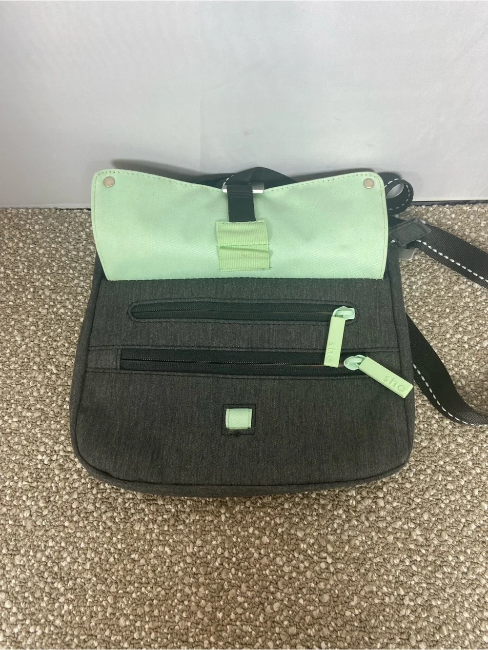 Sherpani Black Crossbody with Mint Trim.Pre-Owned Little small stain,Like New.